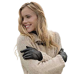 Woman smiling in off white pullover sweater wearing Manhattan gloves